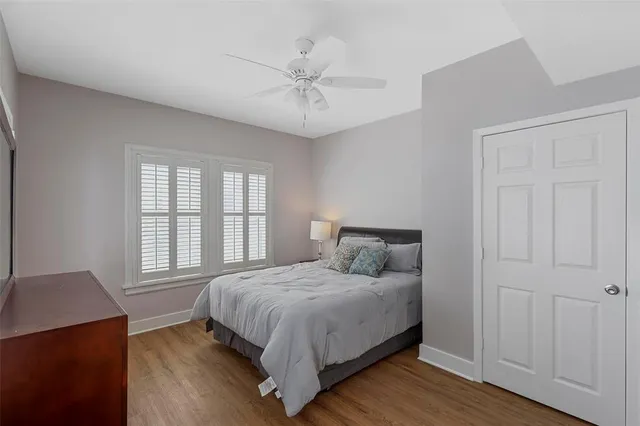 a bedroom with a large bed and a window