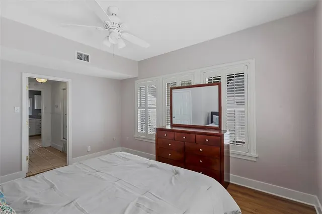 a bedroom with a bed and a dresser