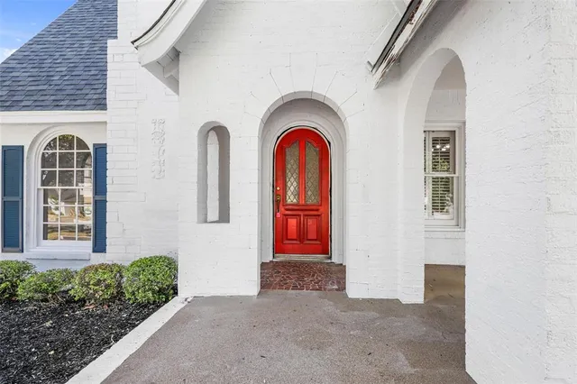 a front view of a house with large windows