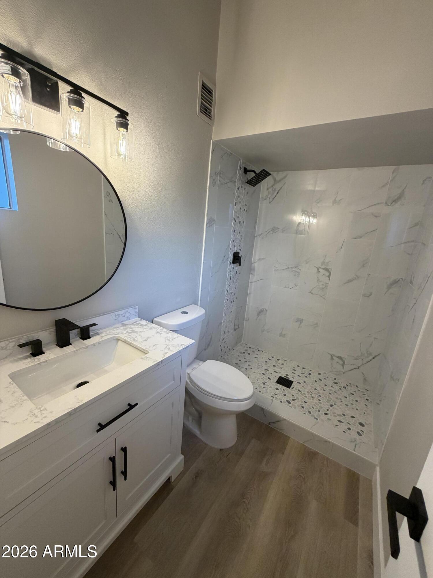 5420 North Granite Reef Road Scottsdale, AZ 85250 - Photo 11 of 30 a bathroom with a sink toilet and shower