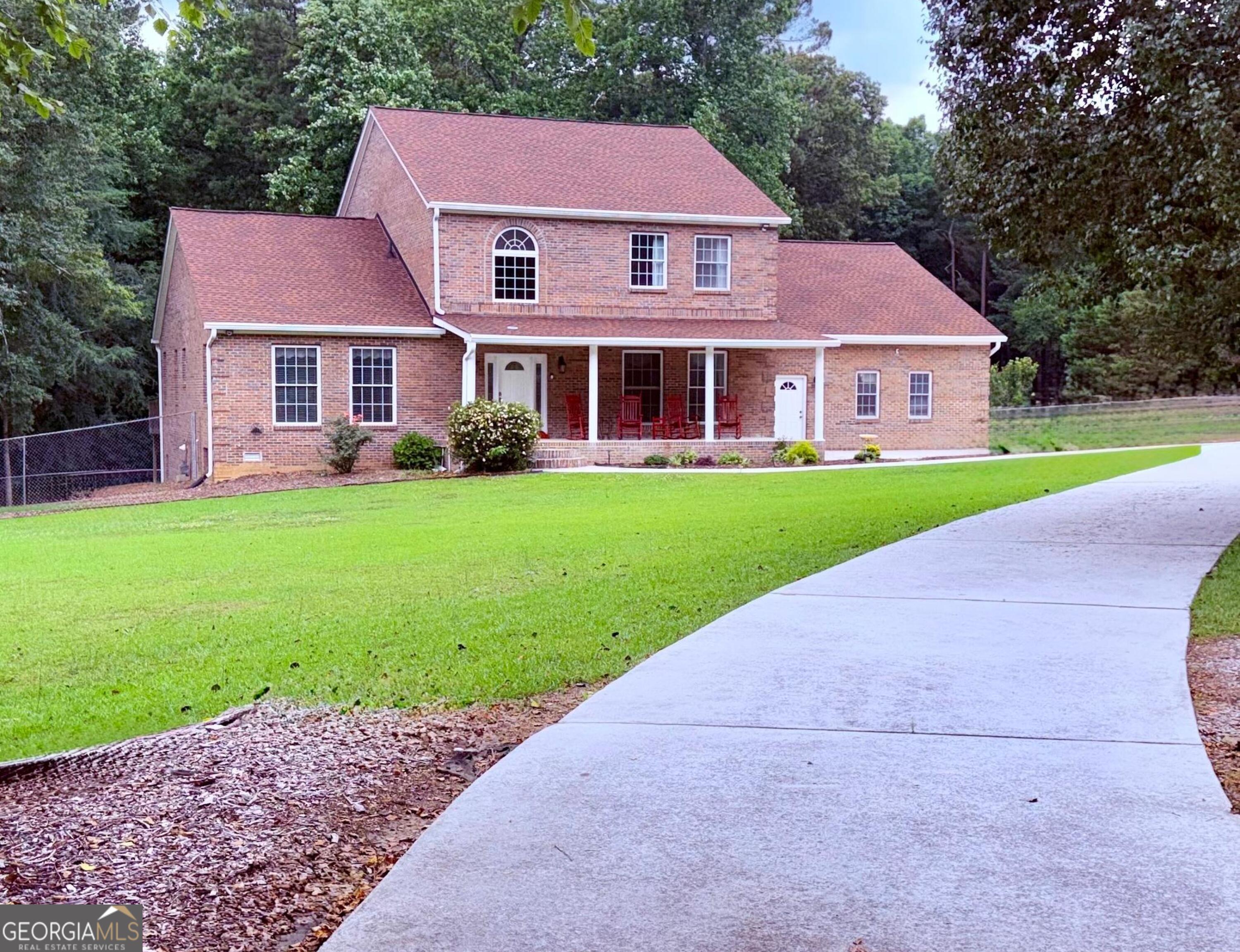 a front view of a house with a yard