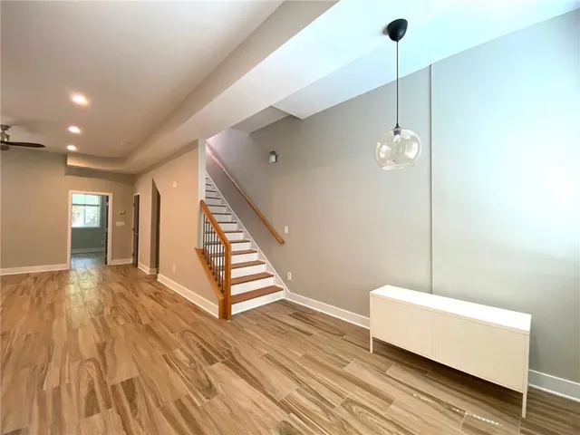 a view of a room with wooden floor