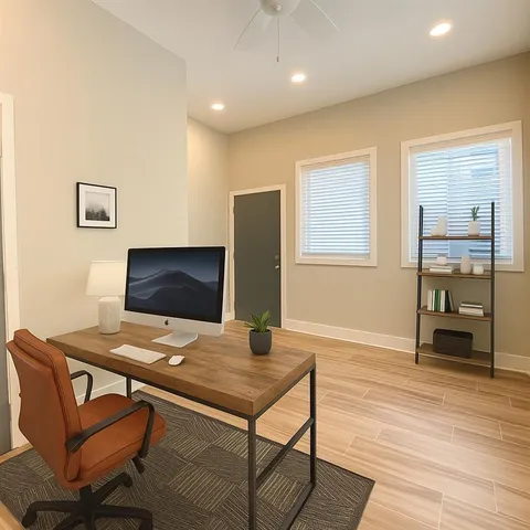 a workspace with furniture and wooden floor