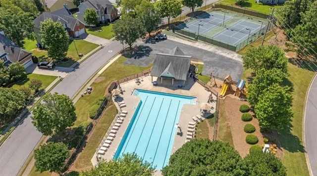 an aerial view of a house with outdoor space