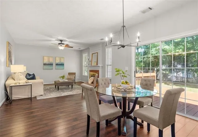 a view of a dining room with furniture window and wooden floor
