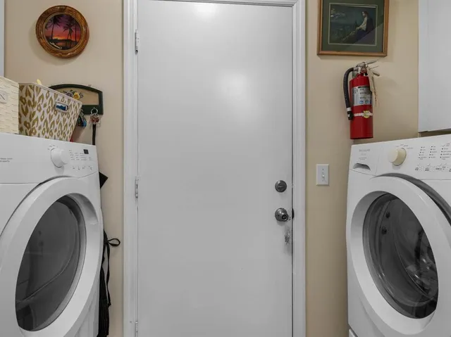 a utility room with dryer and washer