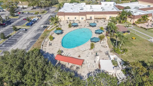 an aerial view of a house with a swimming pool