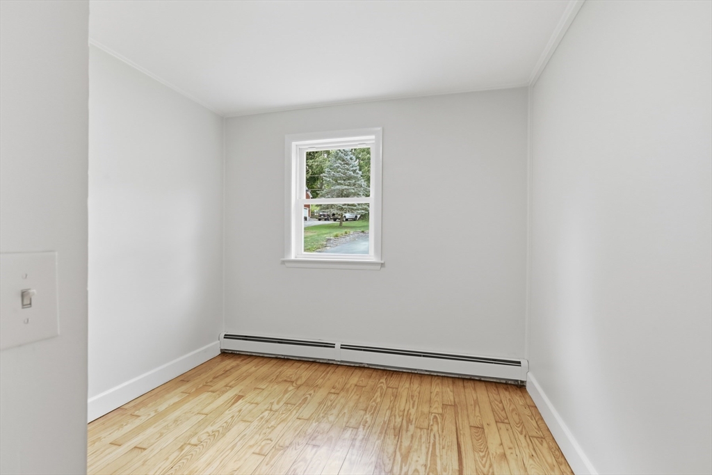 1007 Boston Road Haverhill, MA 01835 - Photo 19 of 32 a view of a room with wooden floor and a window