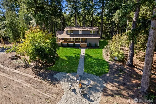 a pathway of a house with a yard