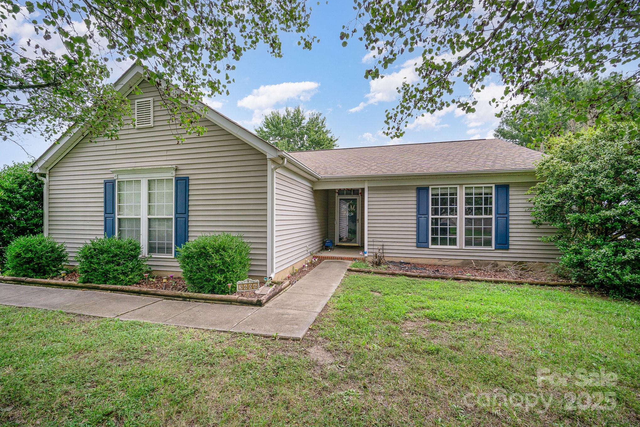 3606 White Swan Court Indian Trail, NC 28079 - Photo 1 of 20 a front view of a house with a garden and yard