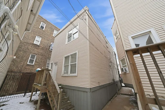 a kitchen with stainless steel appliances a stove a sink and a refrigerator