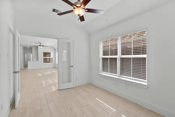 a view of an empty room with a window