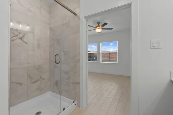 a bathroom with a bathtub and a shower