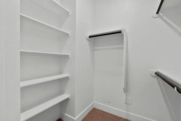 a view of an empty walk in closet