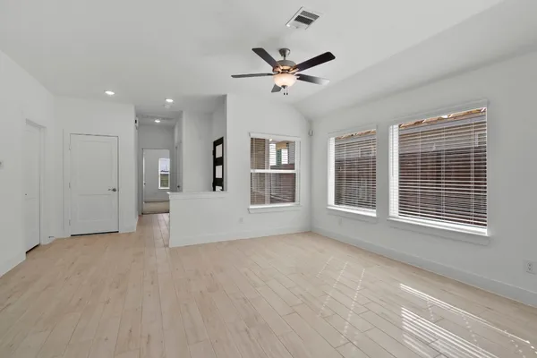 a view of an empty room with a window