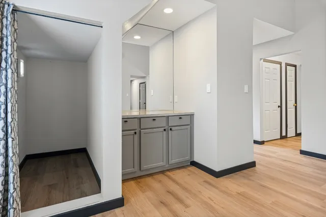 a view of a kitchen with wooden floor
