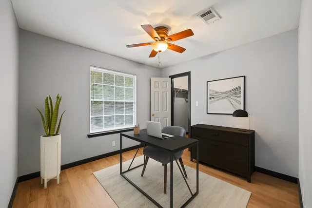 a workspace with furniture and window