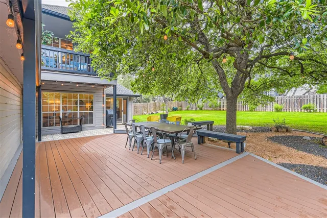an outdoor space with furniture and garden