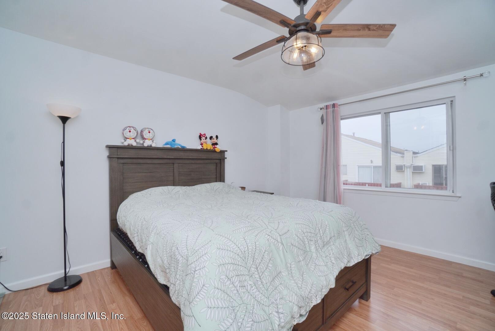 168 Rosedale Avenue Staten Island, NY 10312 - Photo 11 of 21 a bedroom with bed and window