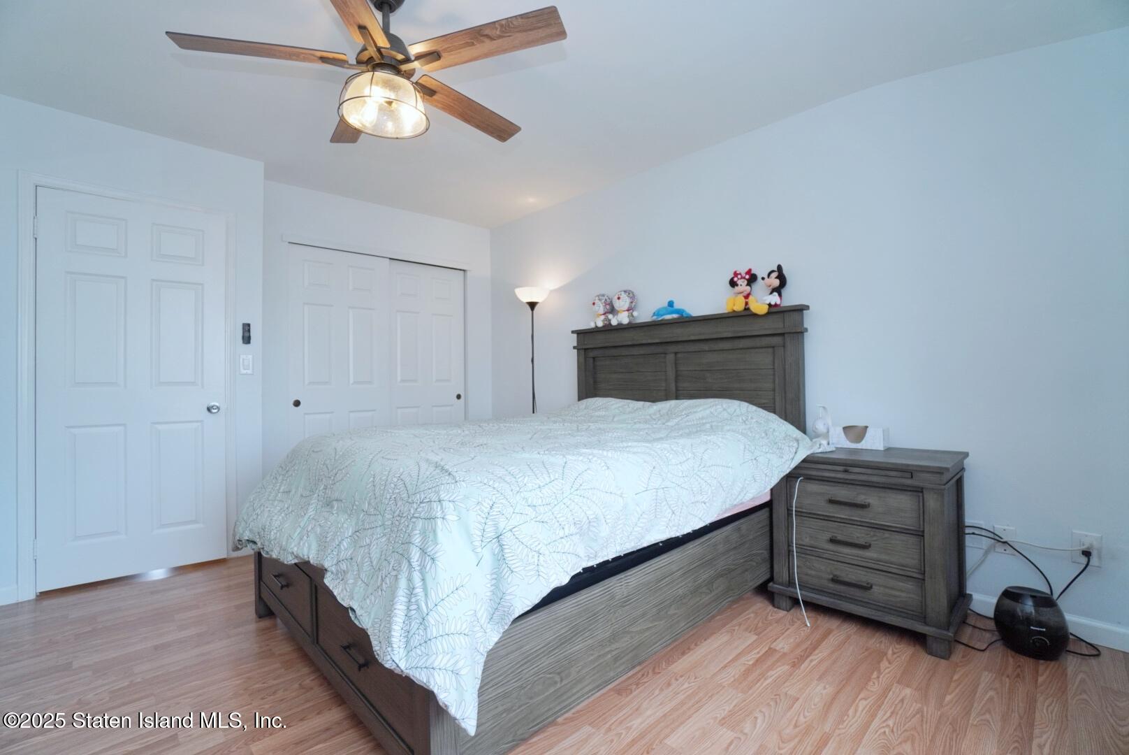 168 Rosedale Avenue Staten Island, NY 10312 - Photo 12 of 21 a bedroom with a bed and a dresser