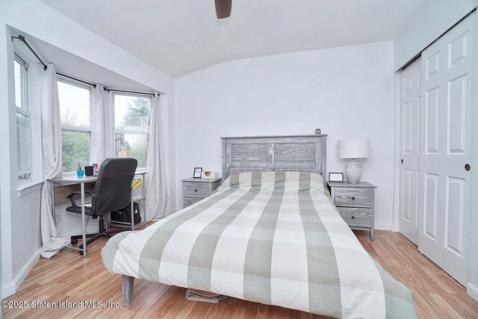 168 Rosedale Avenue Staten Island, NY 10312 - Photo 15 of 21 a bedroom with a bed and a desk