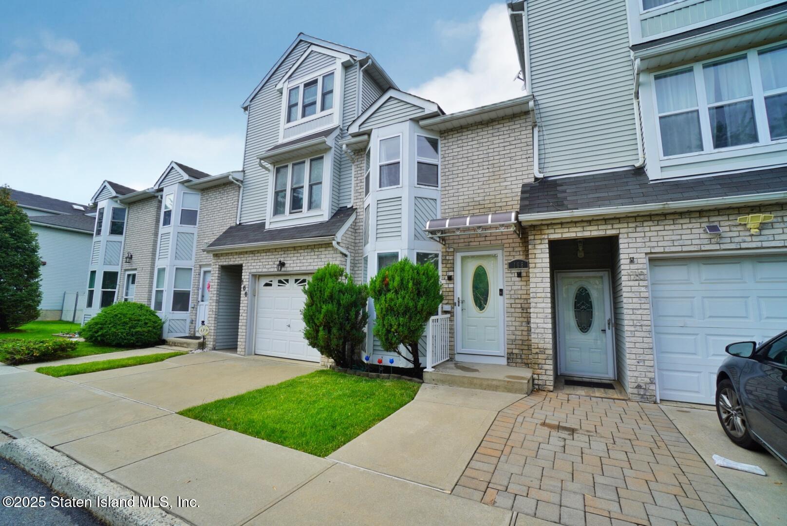 168 Rosedale Avenue Staten Island, NY 10312 - Photo 2 of 21 a front view of a house with garden