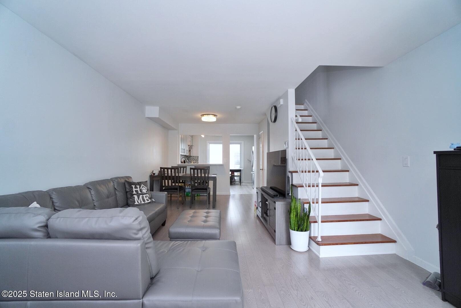 168 Rosedale Avenue Staten Island, NY 10312 - Photo 3 of 21 a living room with furniture and stairs