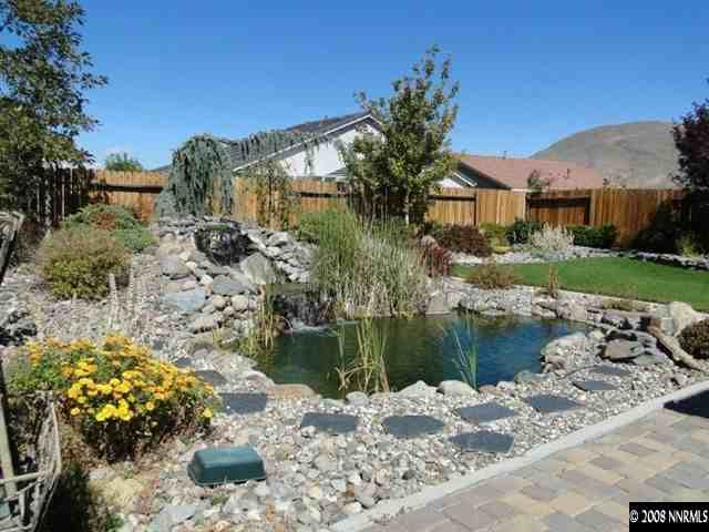1885 San Pablo Drive Reno, NV 89521 - Photo 3 of 8 a front view of a house with a yard