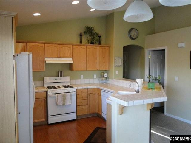 1885 San Pablo Drive Reno, NV 89521 - Photo 5 of 8 a kitchen with a sink cabinets and stainless steel appliances