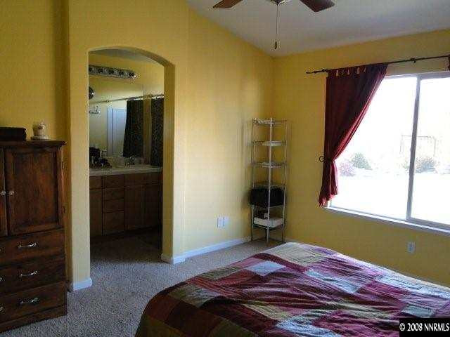 1885 San Pablo Drive Reno, NV 89521 - Photo 7 of 8 a bedroom with a bed and a dresser