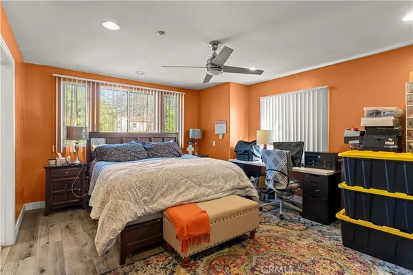 a bedroom with furniture and a window