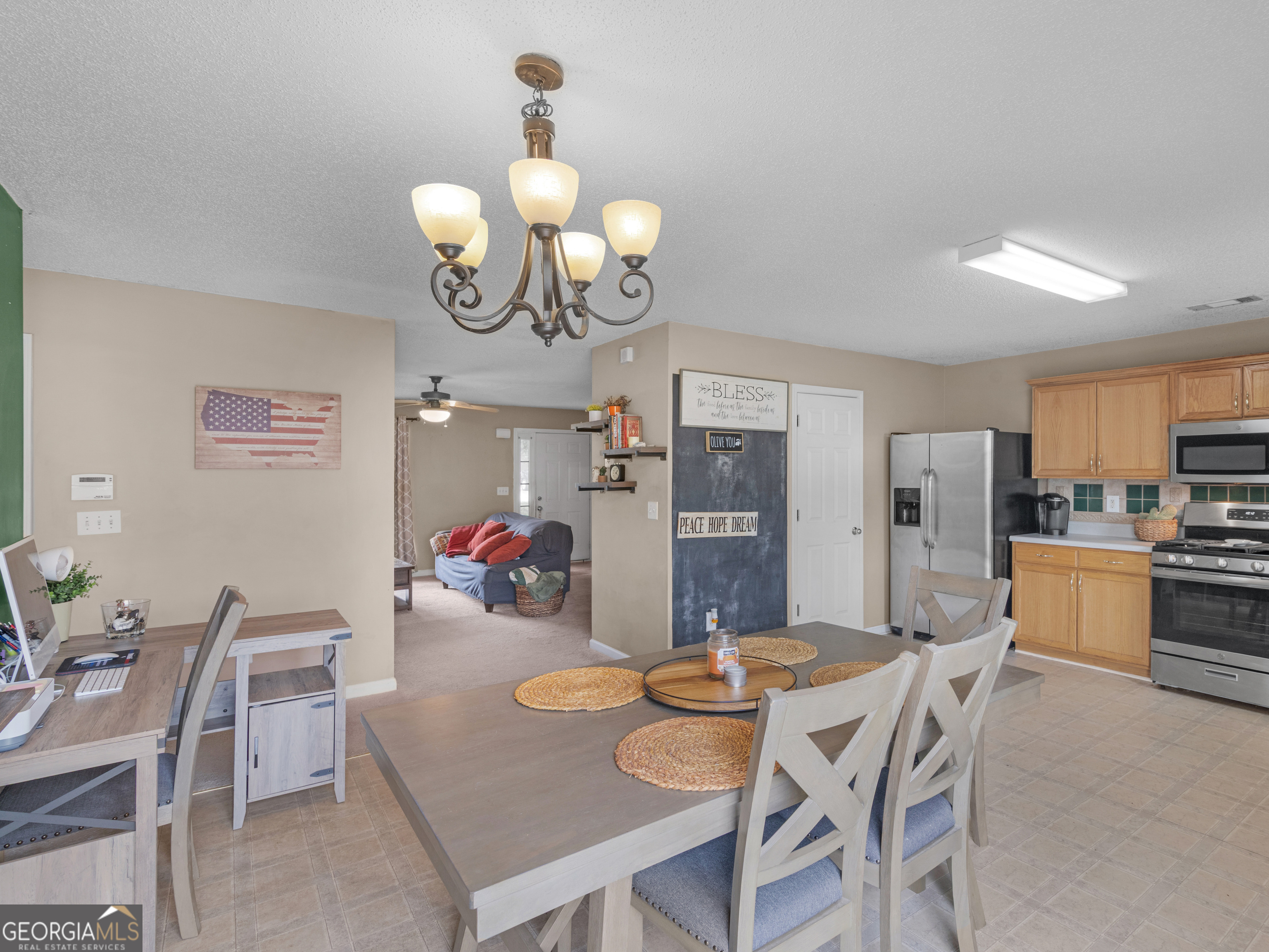 3370 Waggoner Place Rex, GA 30273 - Photo 9 of 25 a view of a dining room with furniture and chandelier