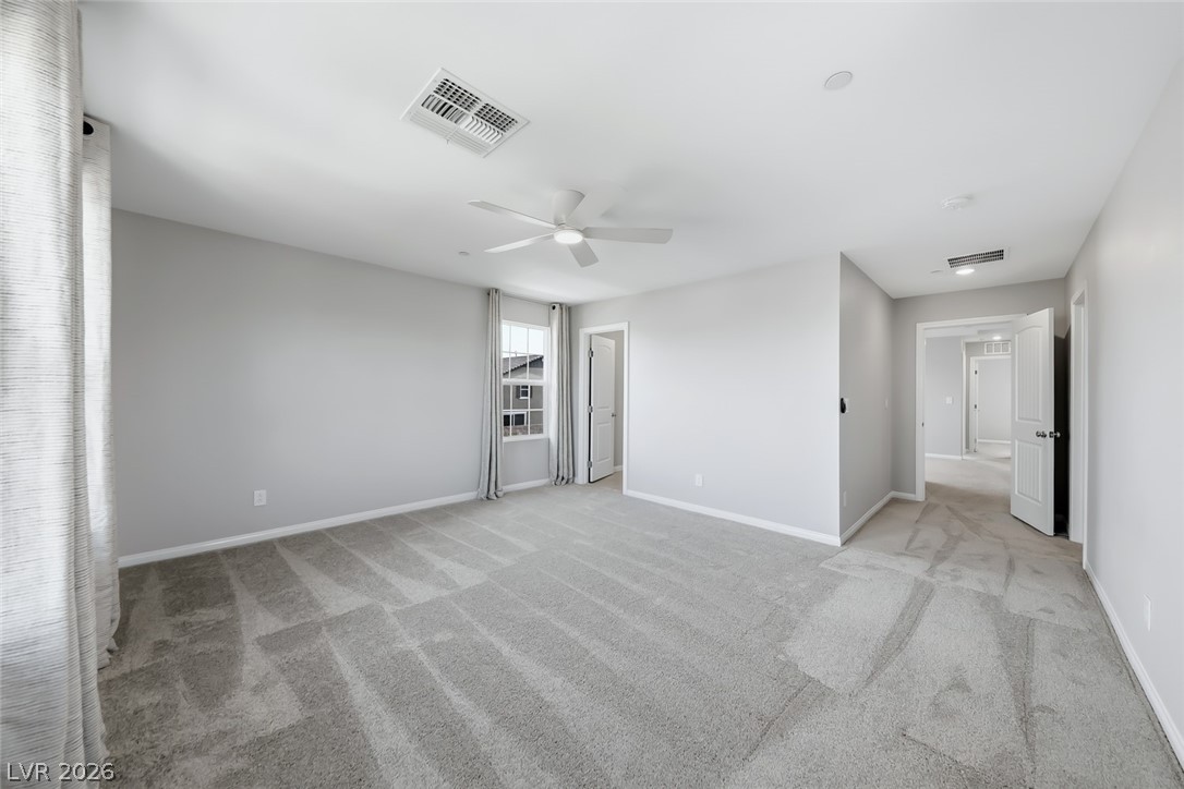 3564 Credere Lane Henderson, NV 89074 - Photo 19 of 40 Unfurnished bedroom featuring light colored carpet and a ceiling fan