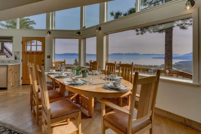 a view of a dining room with furniture window and wooden floor