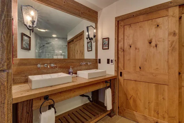 a bathroom with a toilet a sink and a mirror