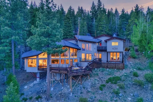 a backyard of a house with yard and outdoor seating