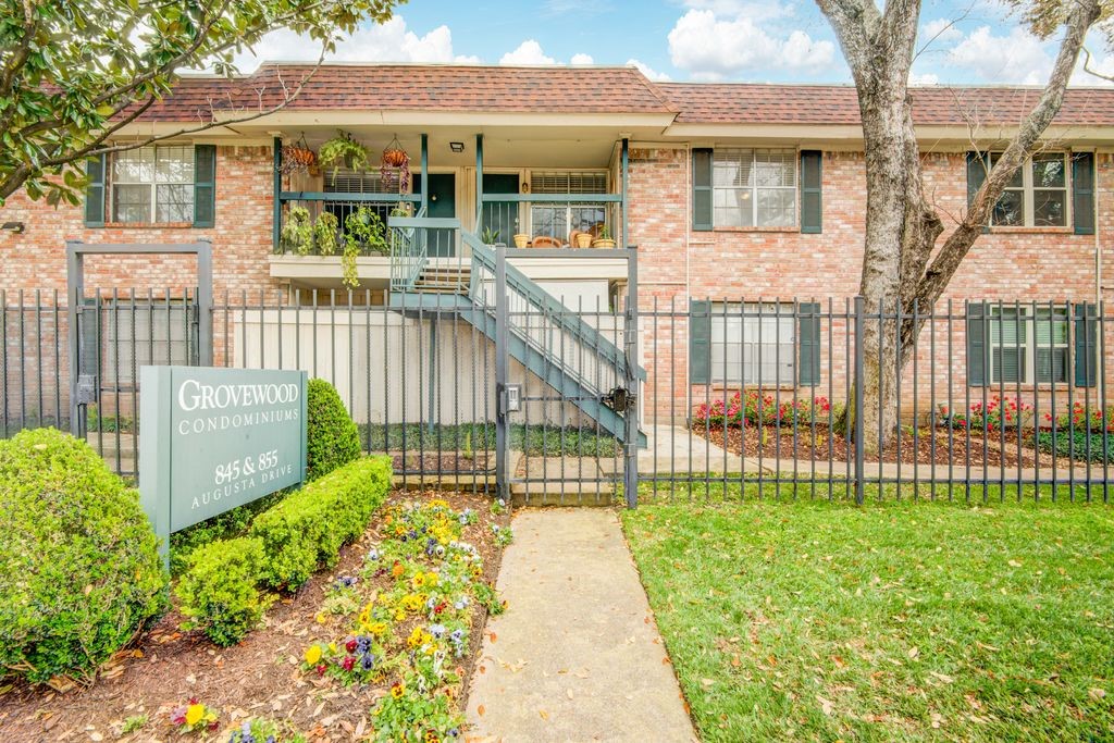 845 Augusta Drive, Unit 6 Houston, TX 77057 - Photo 3 of 8 a view of a house with a small yard and wooden fence