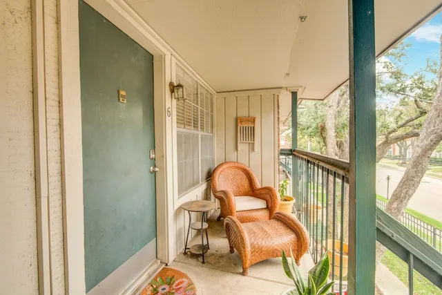 a view of a balcony with chair and dining table