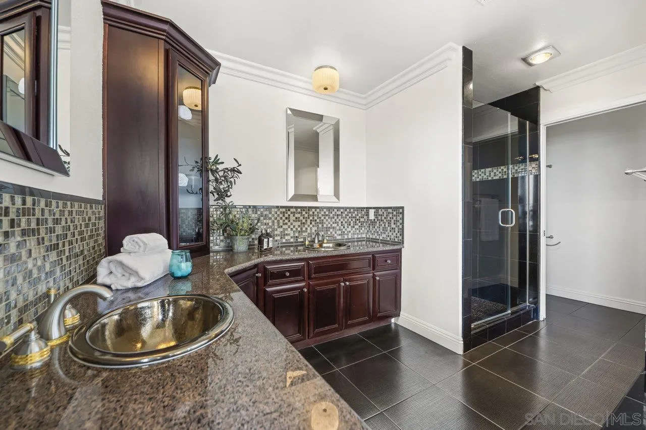 1528 Summit Avenue Cardiff, CA 92007 - Photo 7 of 13 a bathroom with a sink a toilet and a mirror