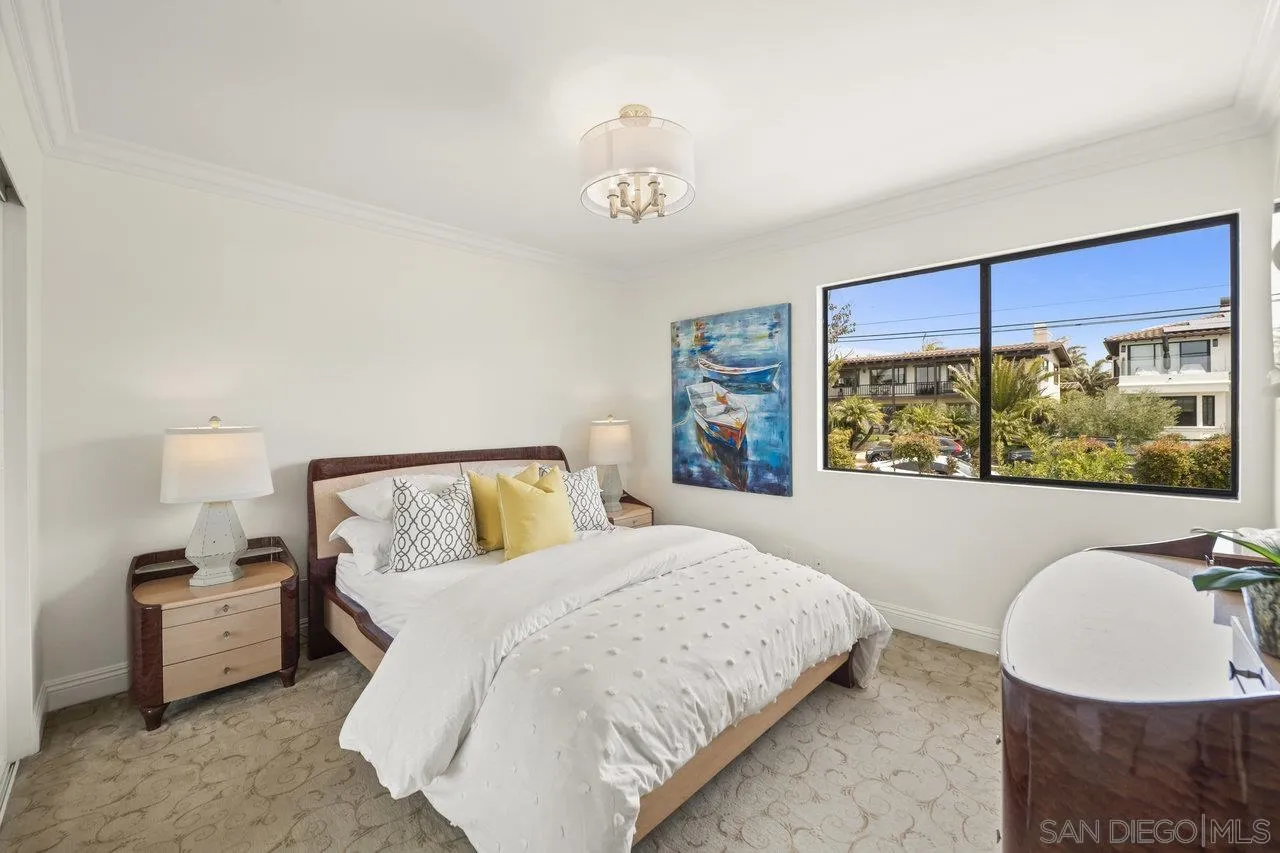 1528 Summit Avenue Cardiff, CA 92007 - Photo 8 of 13 a bedroom with a bed and a flat screen tv