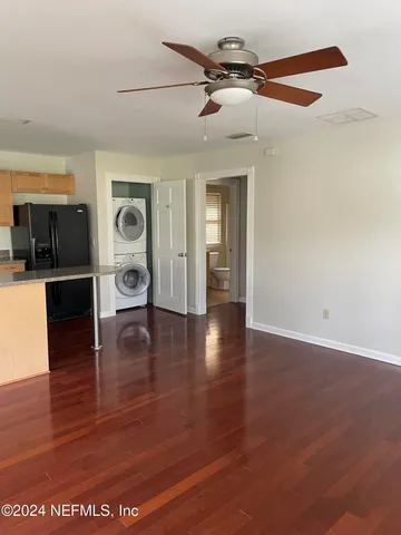 a view of livingroom with furniture wooden floor and window