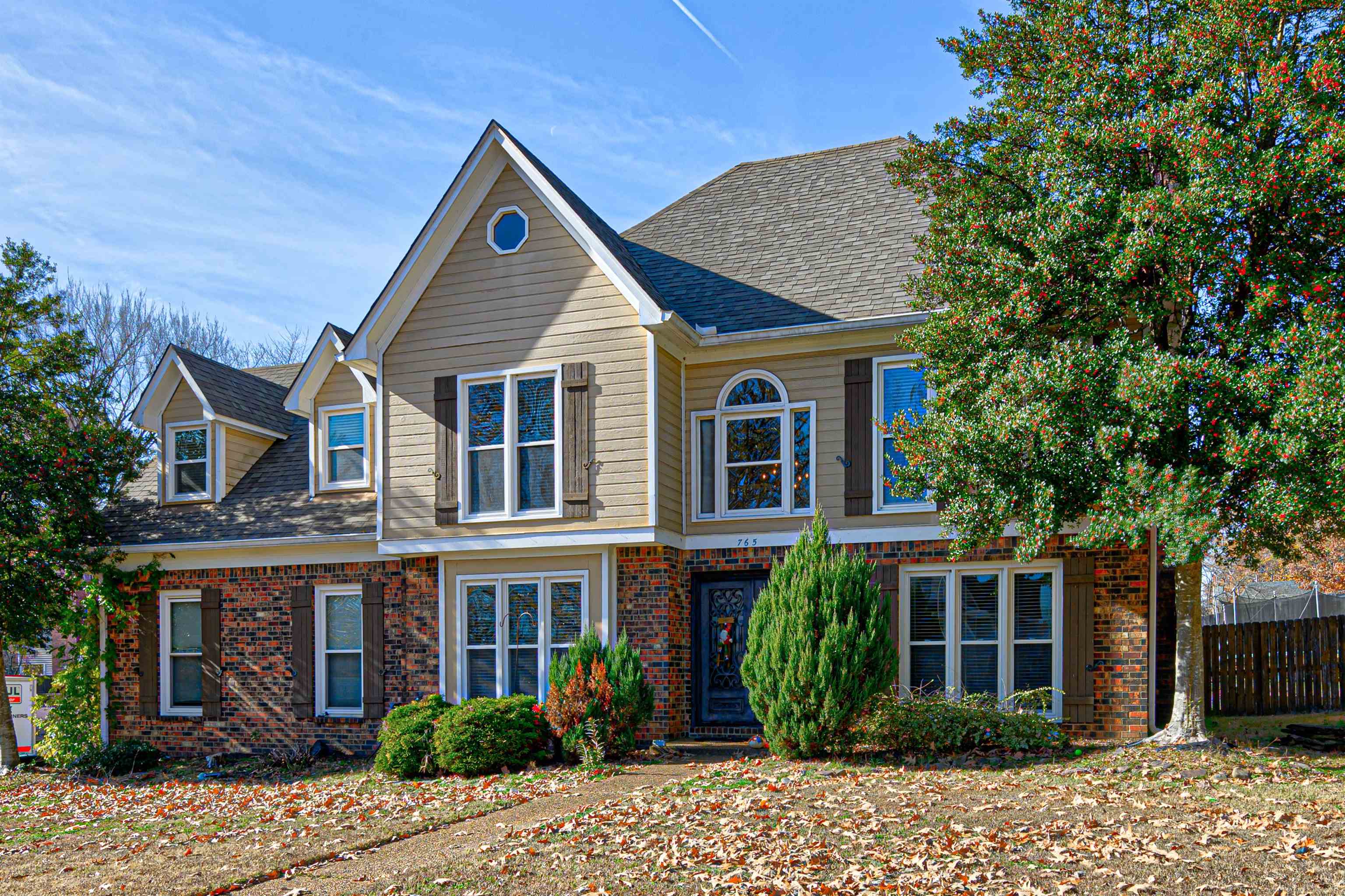 765 Pine Grove Cove Collierville, TN 38017 - Photo 1 of 31 a view of a house with a yard plants and large tree