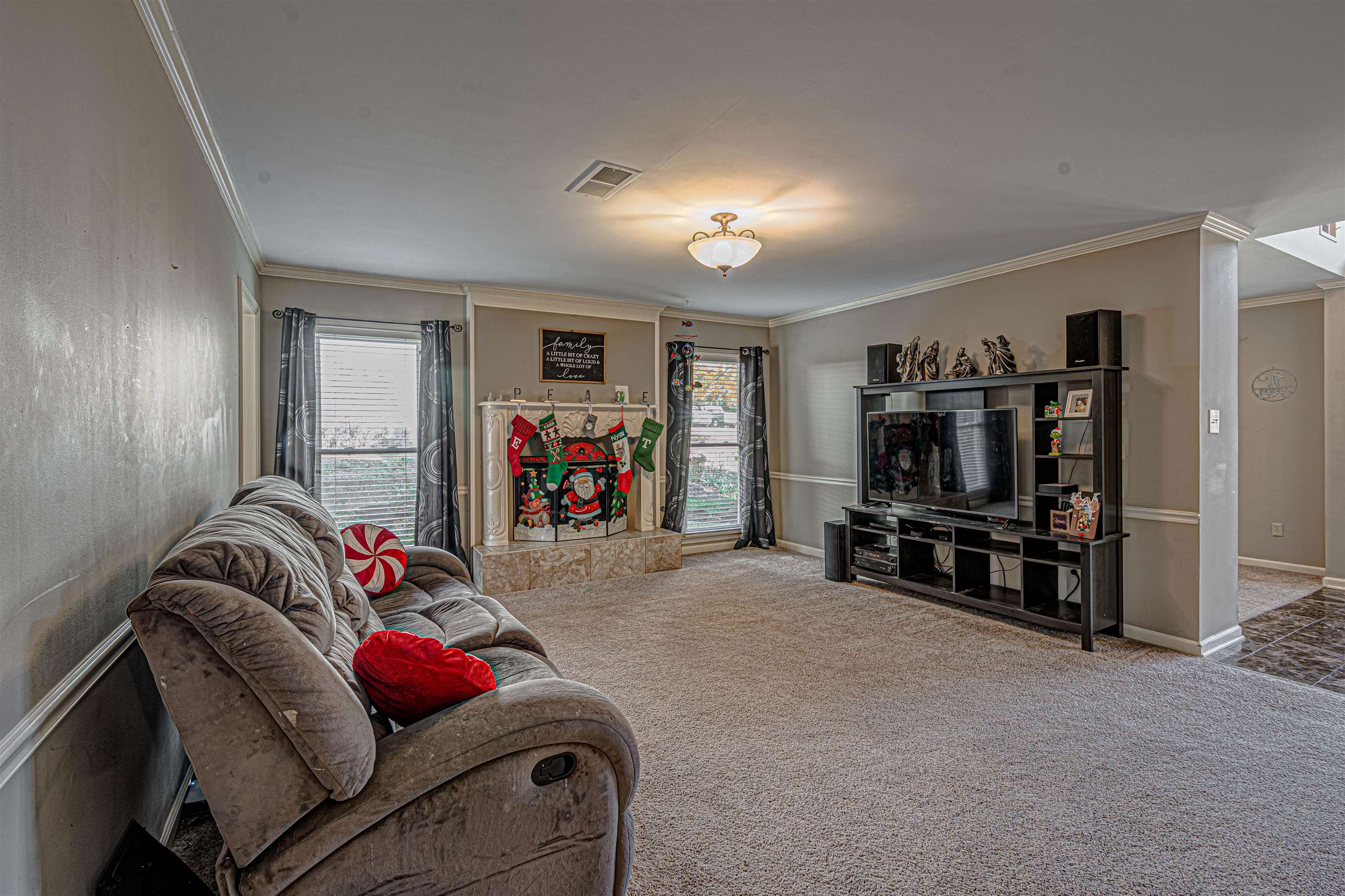 765 Pine Grove Cove Collierville, TN 38017 - Photo 13 of 31 a living room with furniture a flat screen tv and a couch