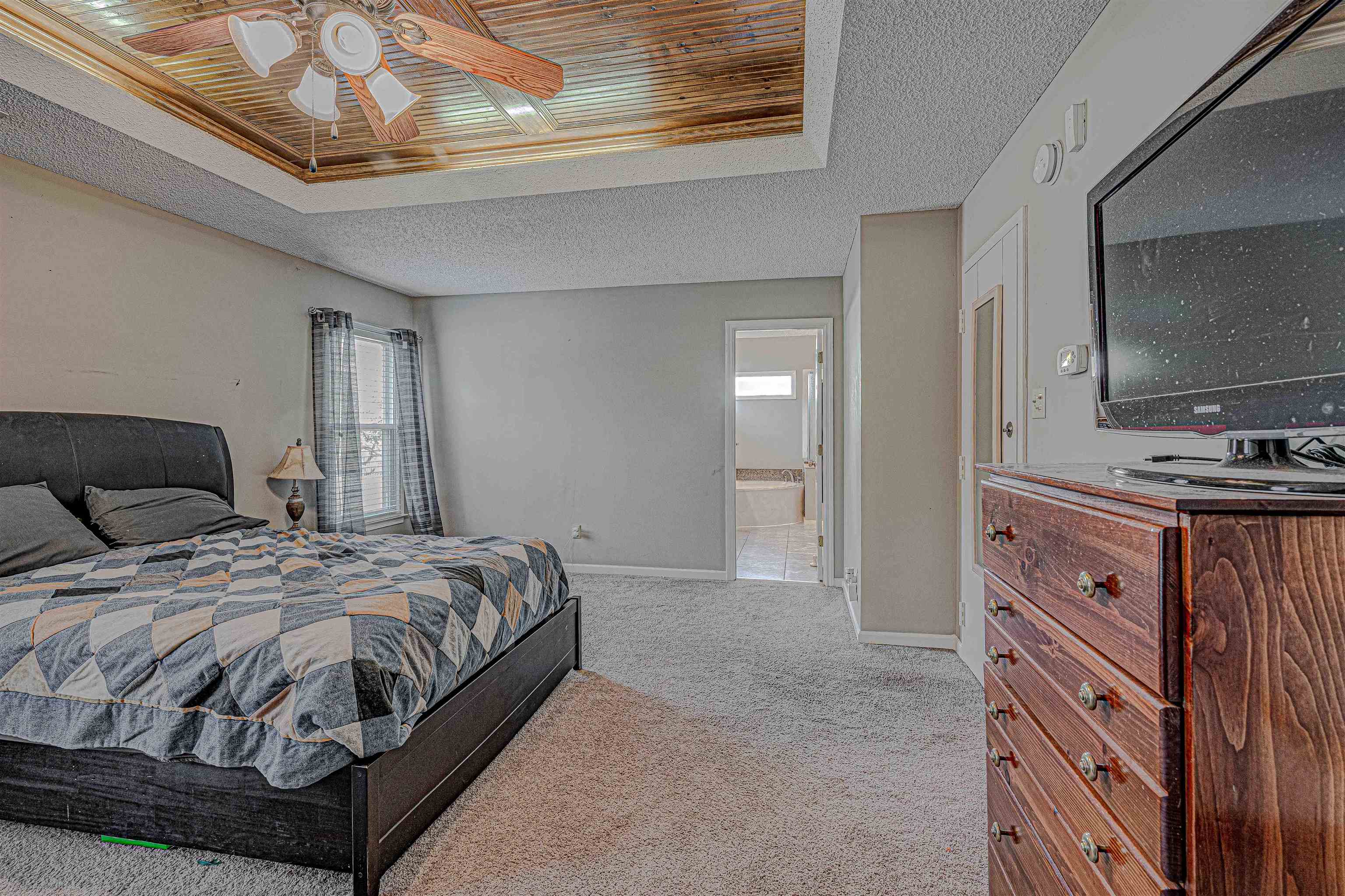 765 Pine Grove Cove Collierville, TN 38017 - Photo 18 of 31 a bedroom with a bed and a flat screen tv