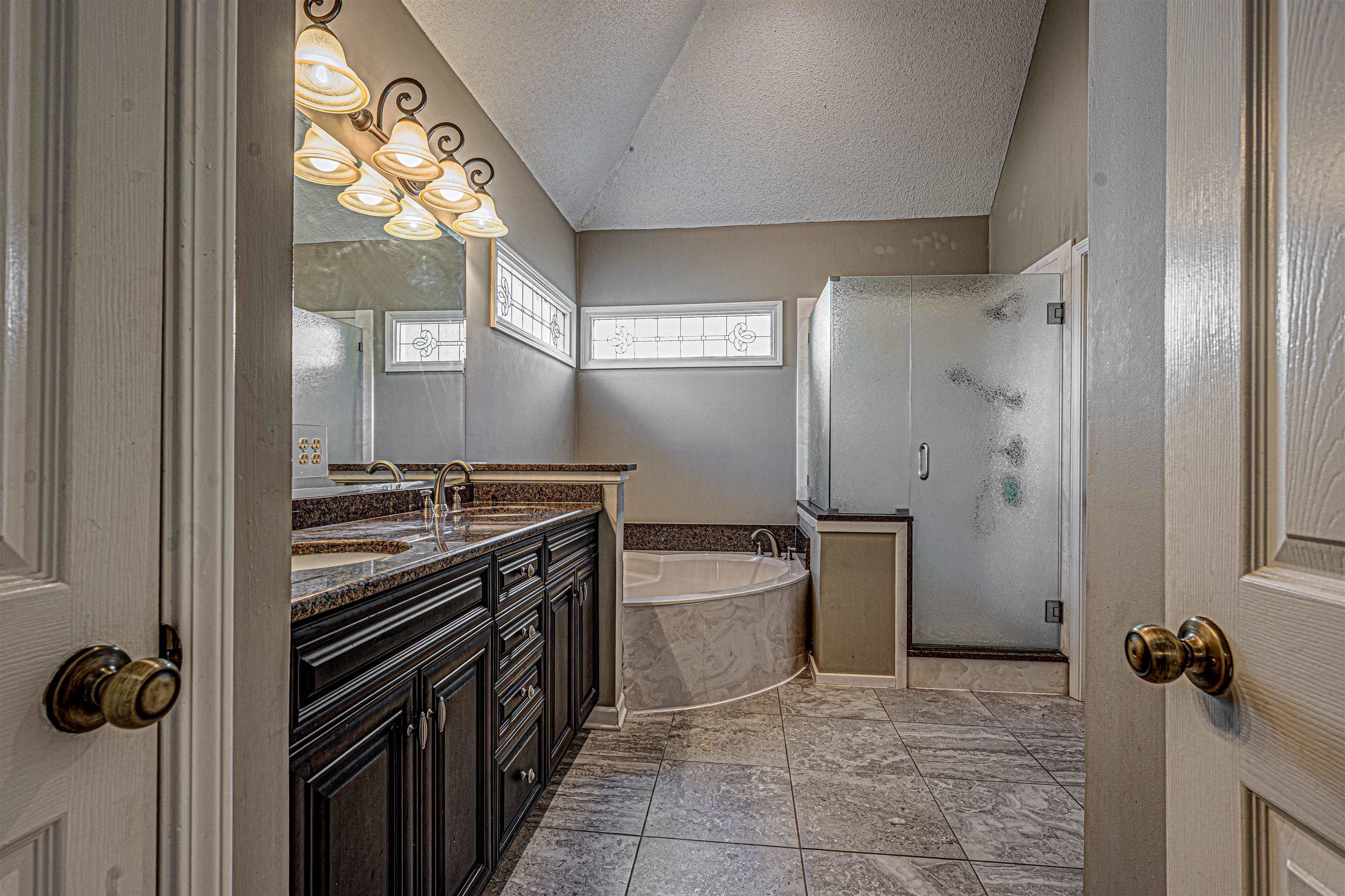 765 Pine Grove Cove Collierville, TN 38017 - Photo 19 of 31 a bathroom with a sink a toilet and shower