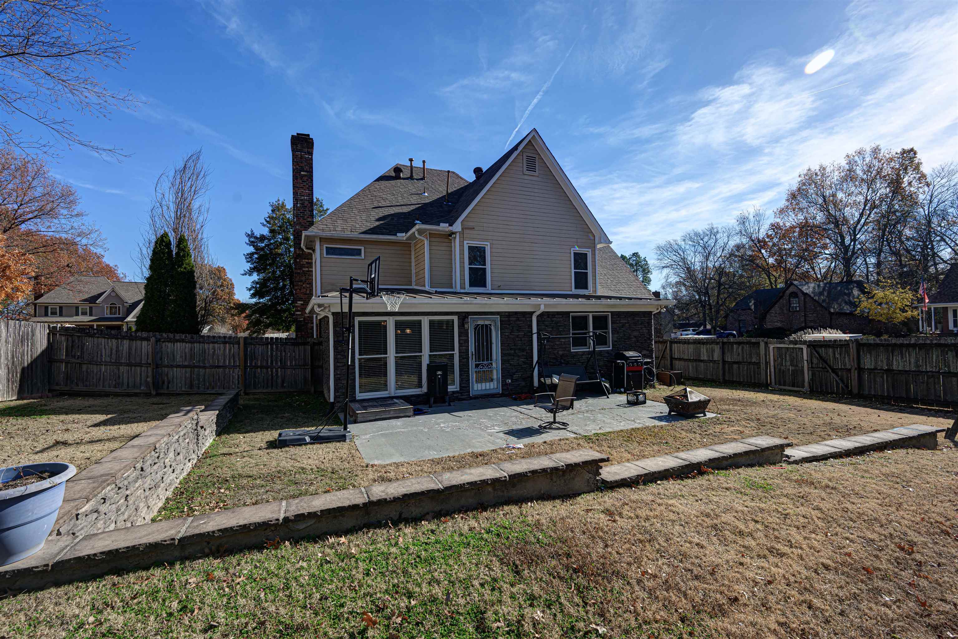 765 Pine Grove Cove Collierville, TN 38017 - Photo 26 of 31 a front view of a house with yard and trees in the background