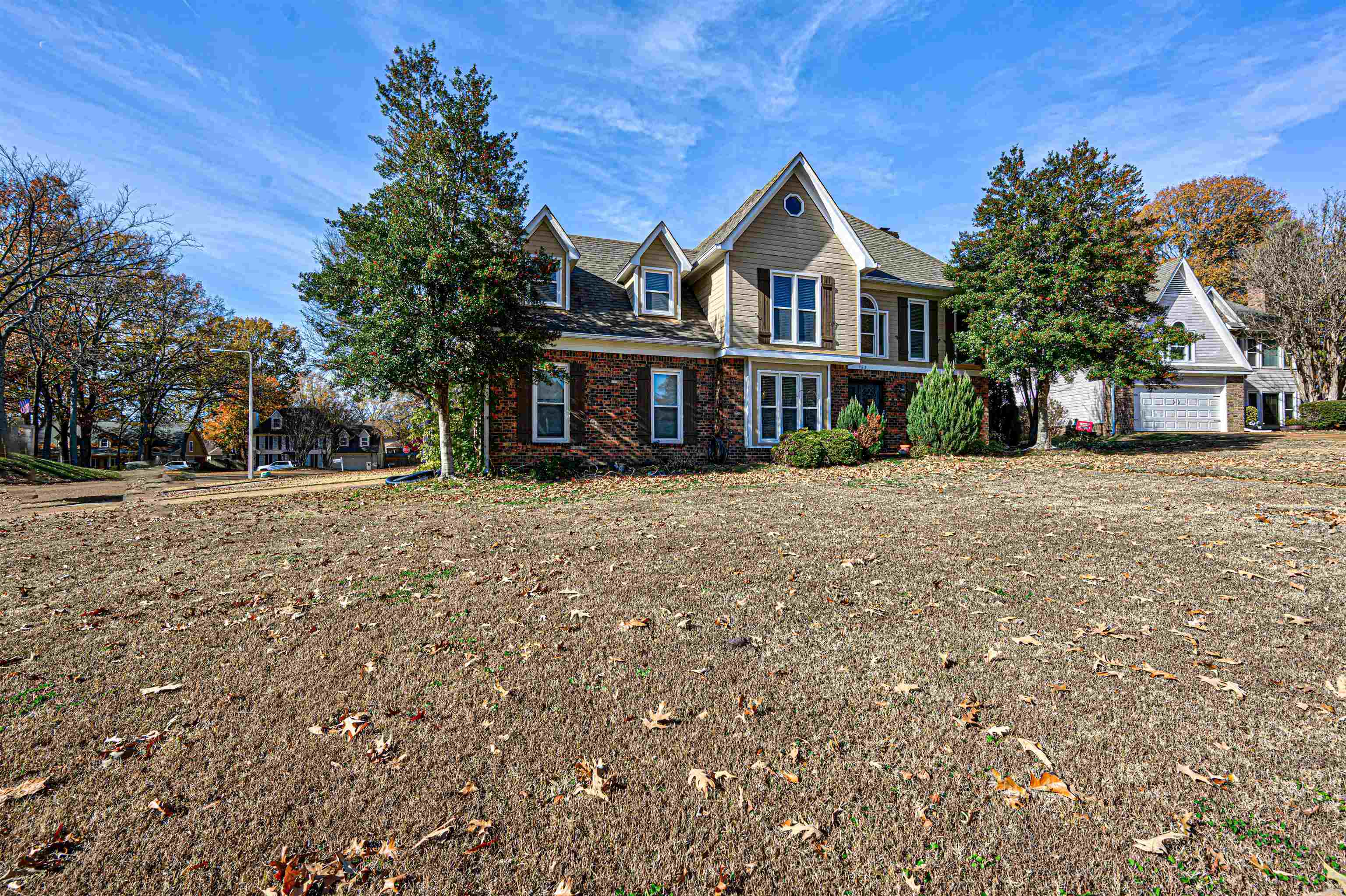 765 Pine Grove Cove Collierville, TN 38017 - Photo 27 of 31 a view of a big house with a big yard and large trees