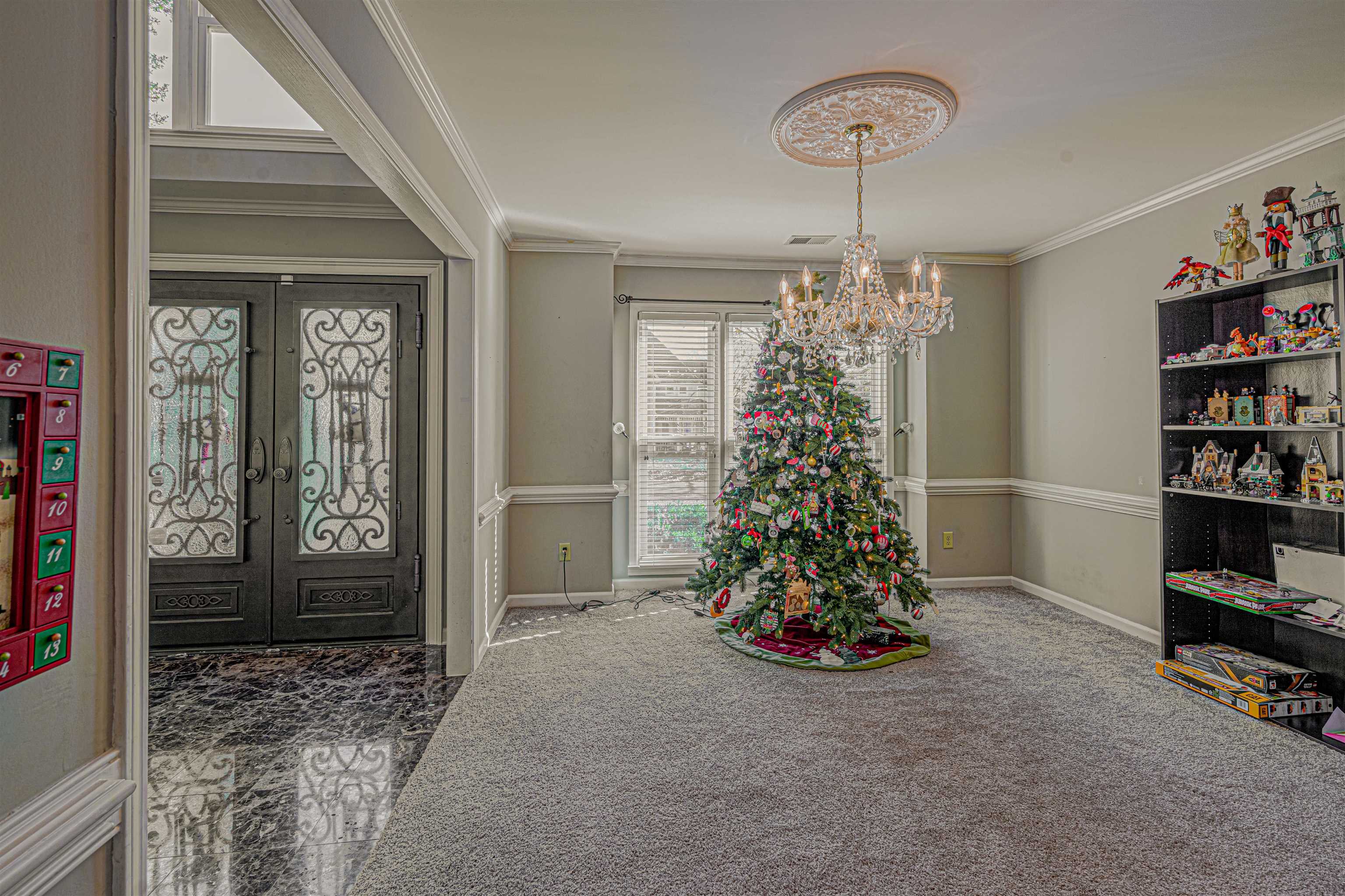 765 Pine Grove Cove Collierville, TN 38017 - Photo 5 of 31 a living room with furniture and a chandelier