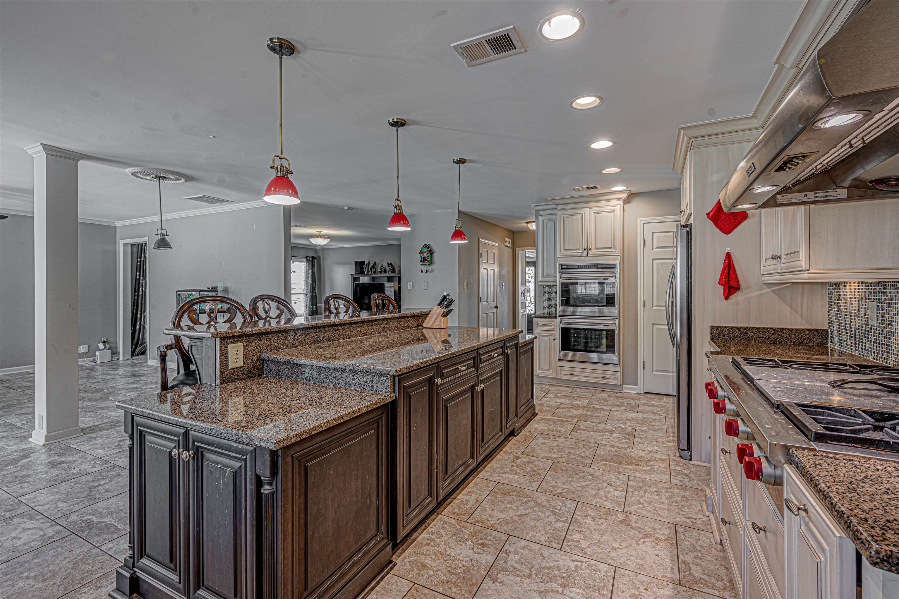 765 Pine Grove Cove Collierville, TN 38017 - Photo 7 of 31 a kitchen with stainless steel appliances granite countertop a sink stove and cabinets