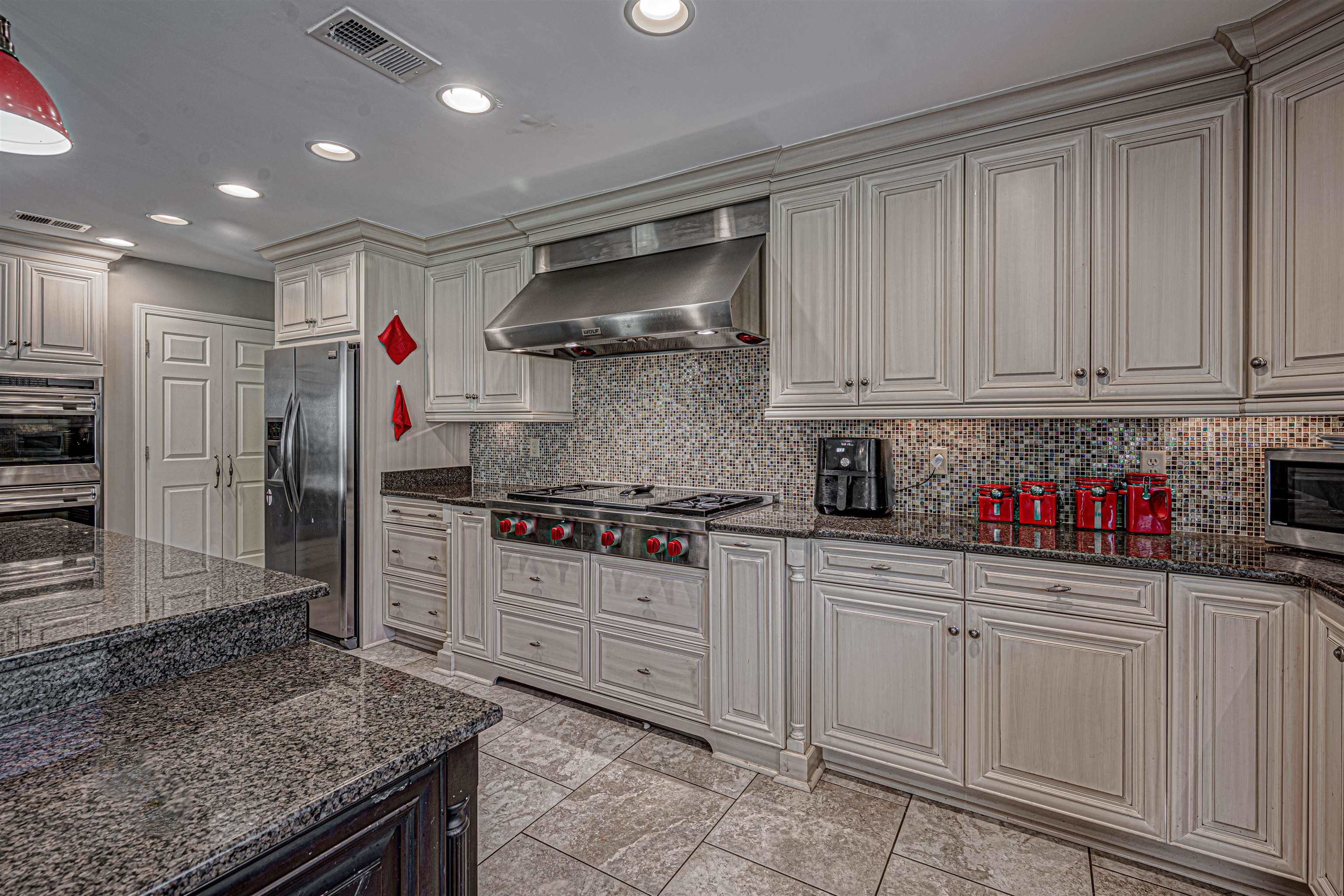 765 Pine Grove Cove Collierville, TN 38017 - Photo 8 of 31 a kitchen with granite countertop a sink and cabinets